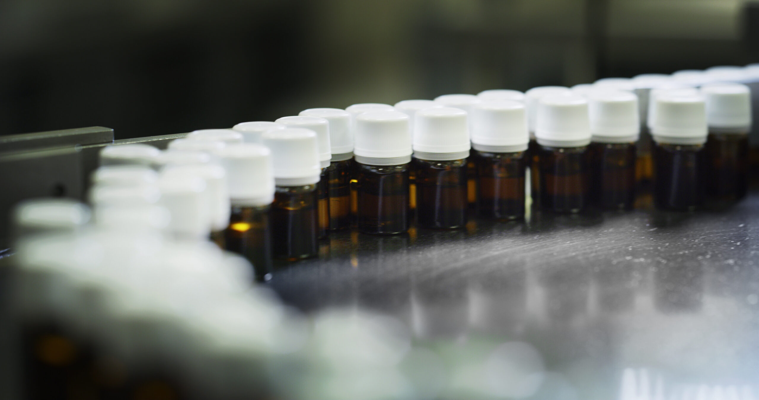 Medicines In Glassware Bottles On Automatic Lines