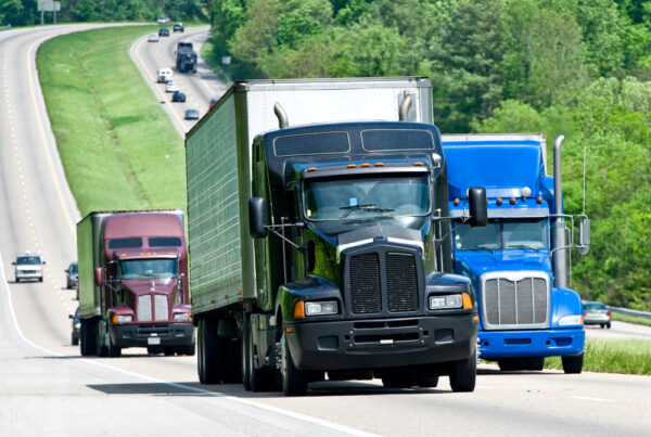 trucks driving down highway
