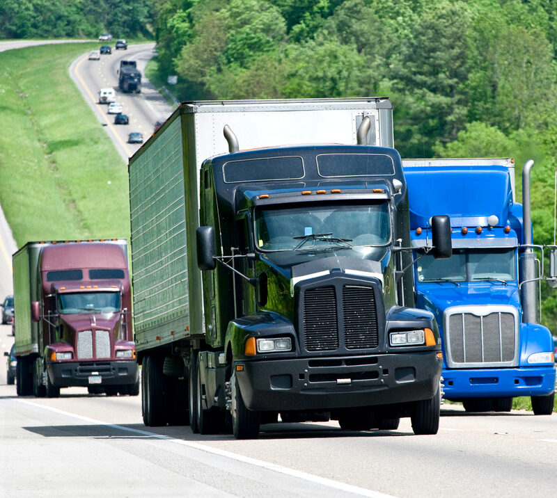 trucks driving down highway